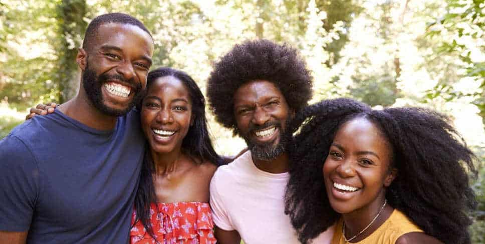 A group of young, smiling, black people.